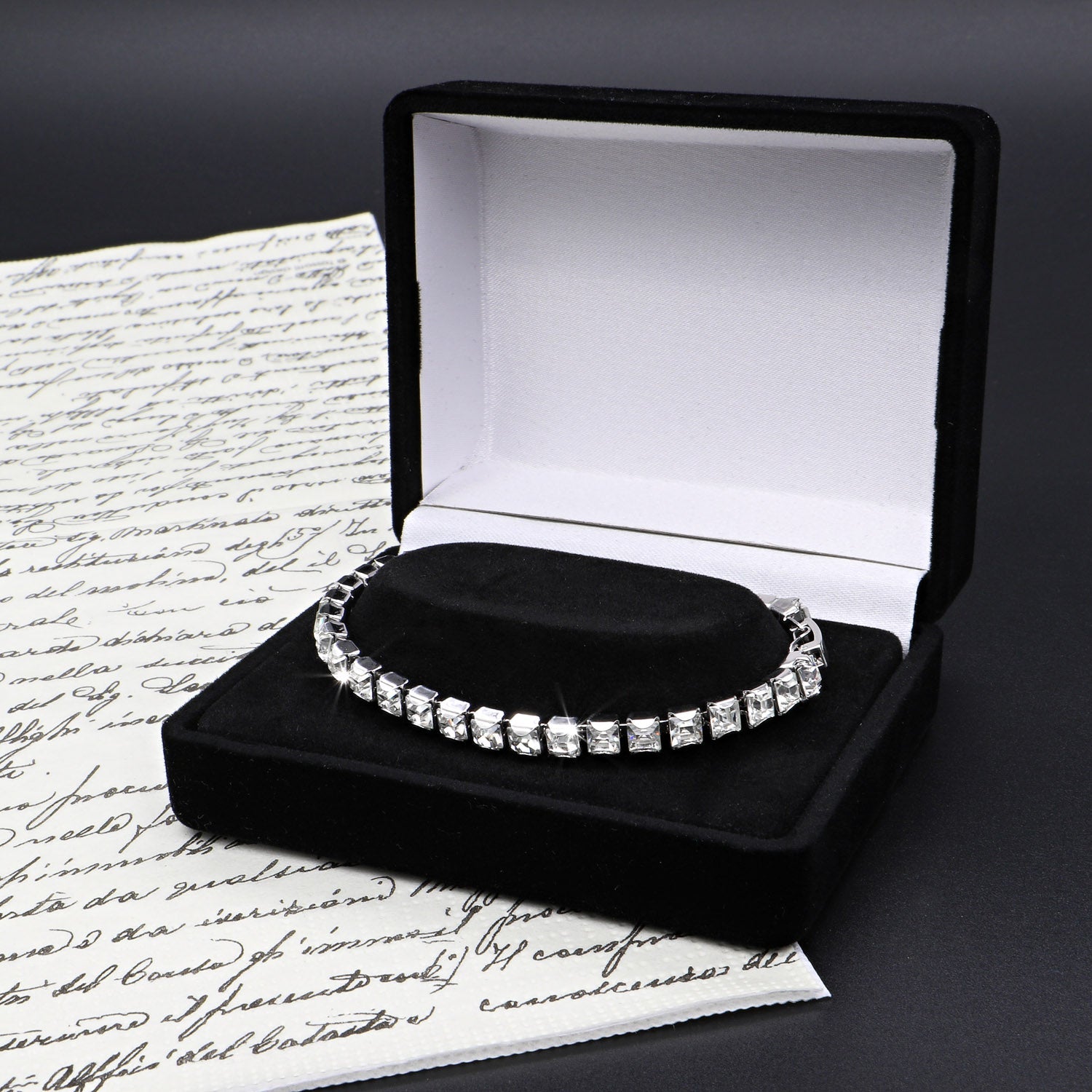 Rhodium plated tennis bracelet adorned with SWAROVSKI® Crystals, showcasing a sleek silver design.