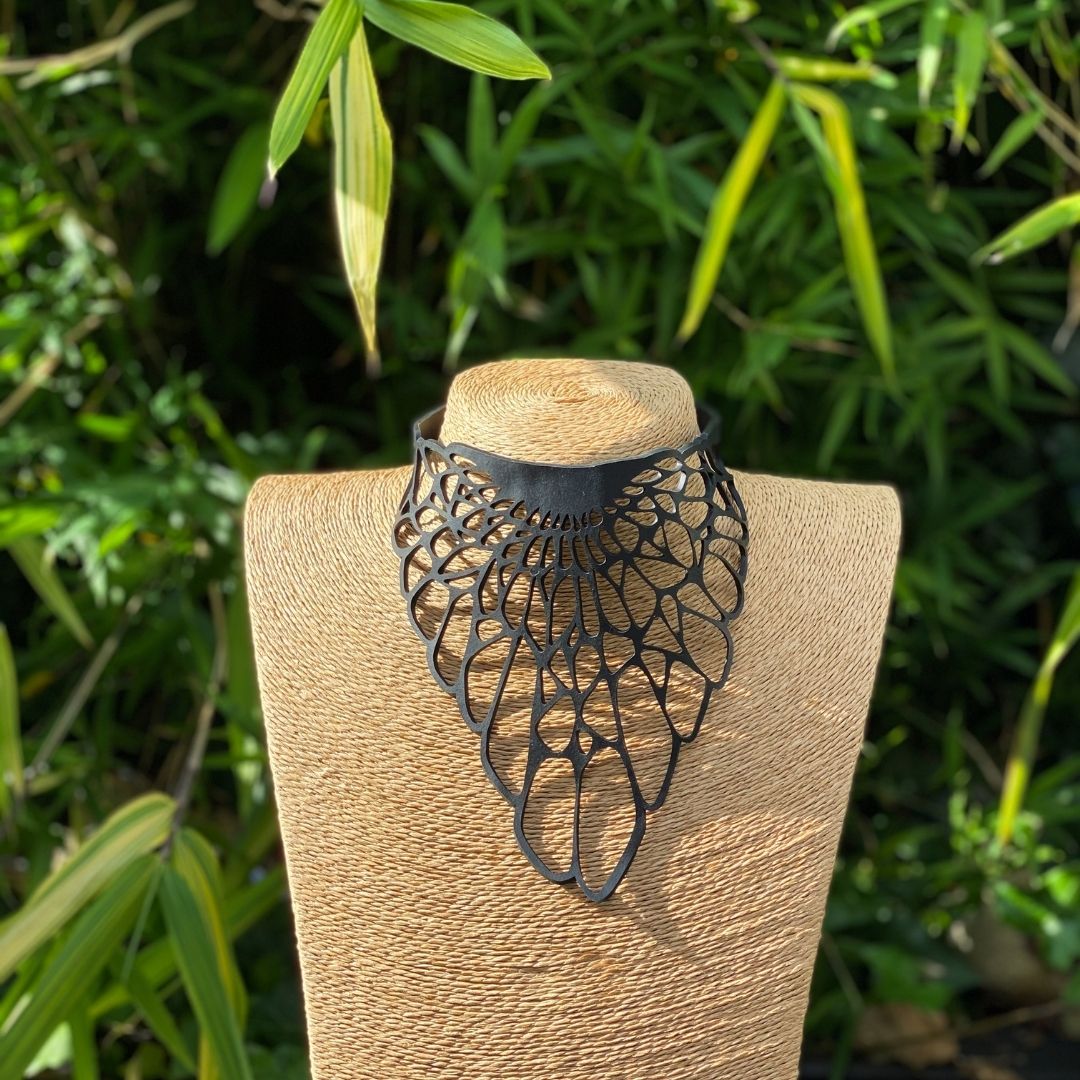 Queen Mab Geometric Statement Choker made from recycled rubber, featuring a bold geometric design and adjustable length.