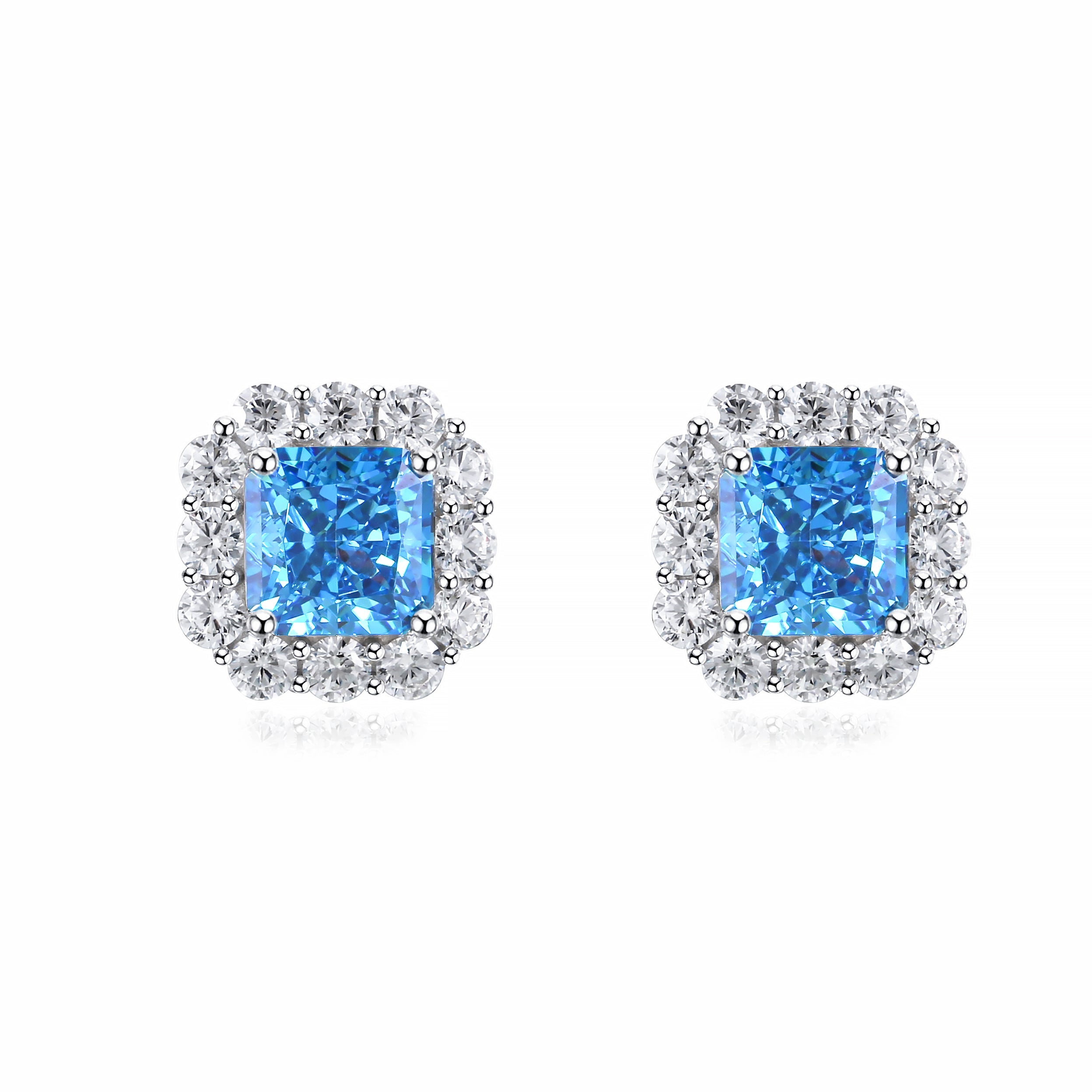 Radiant cut halo earrings featuring white sapphire and aquamarine accents, crafted from 925 sterling silver with white gold plating.