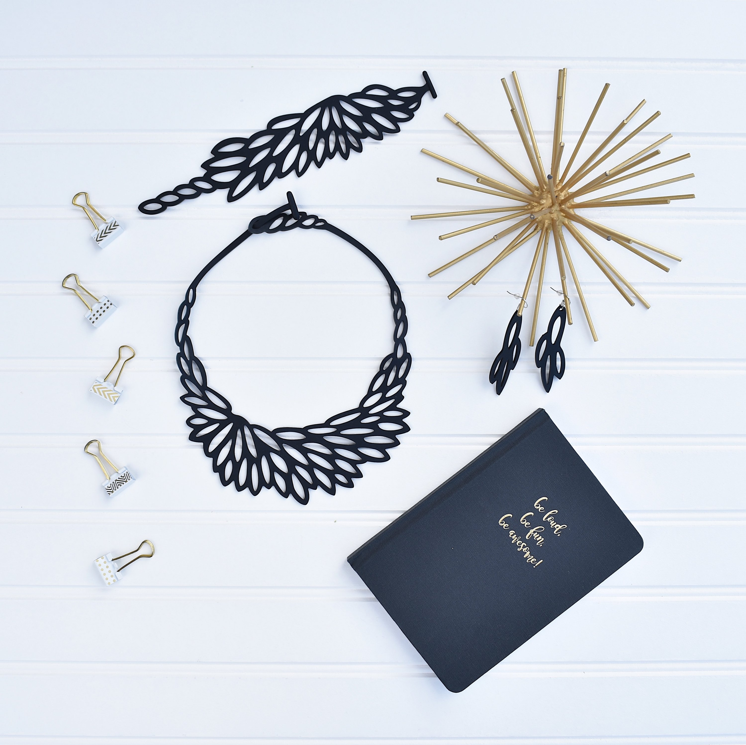 A stunning Radiant Necklace displayed elegantly in a velvet pouch, showcasing its unique design and lightweight features.