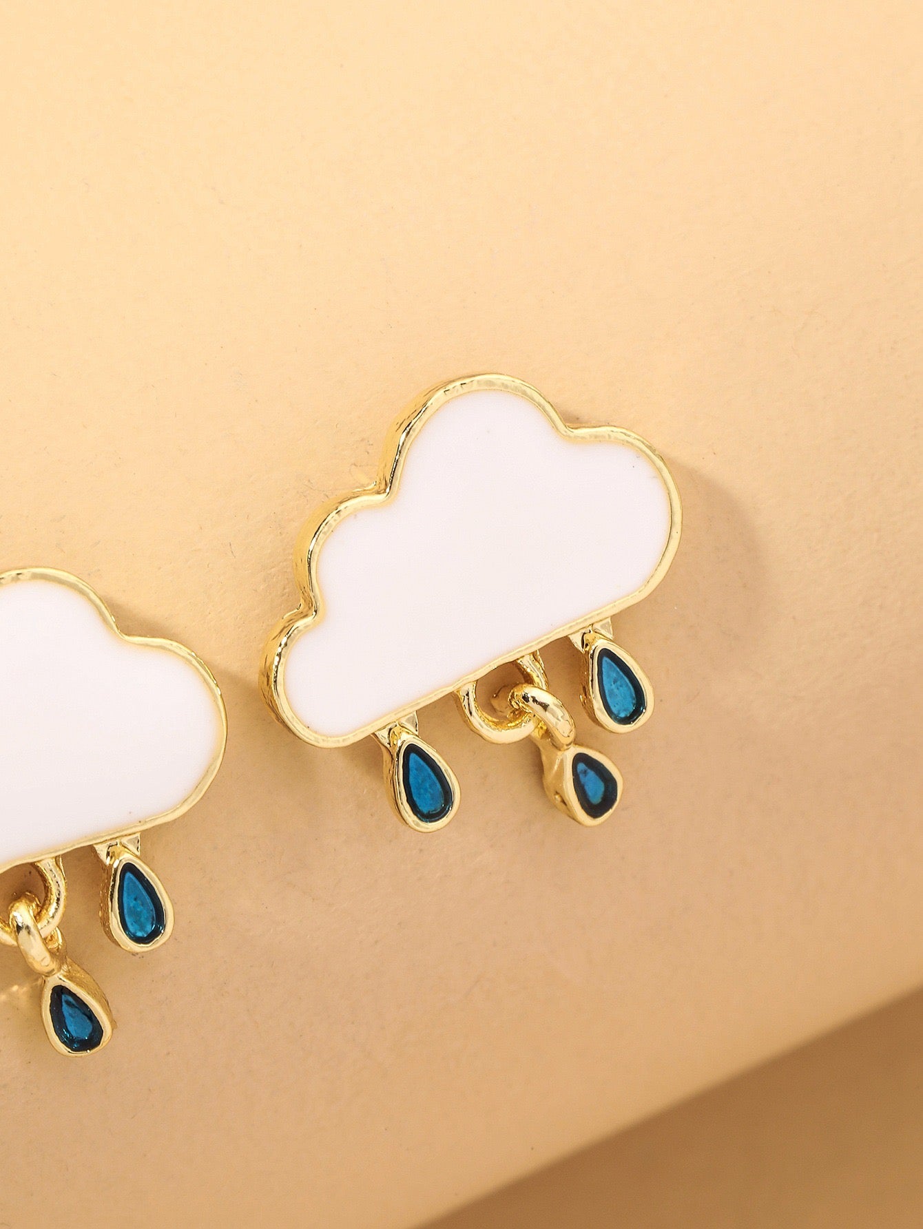 A pair of stylish Raining Cloud Short Earrings made from alloy and S925 silver, featuring a unique cloud design.