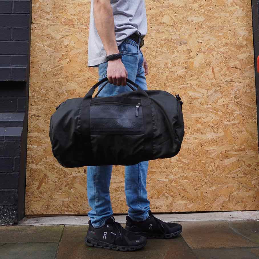 Ranger Water Resistant Duffle Vegan Gym Bag made from recycled military canvas, featuring a spacious design and adjustable shoulder strap.