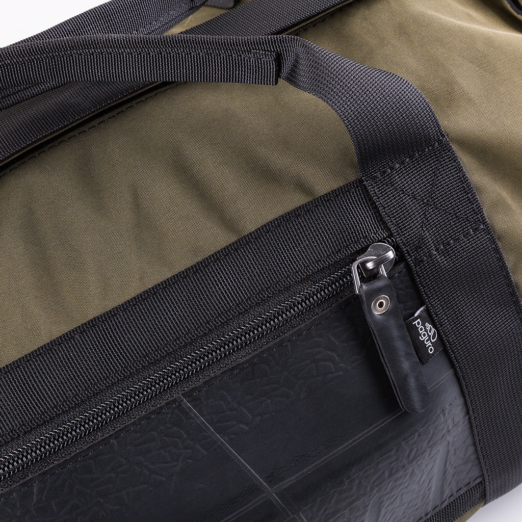 Ranger Water Resistant Duffle Vegan Gym Bag made from recycled military canvas, featuring a spacious design and adjustable shoulder strap.