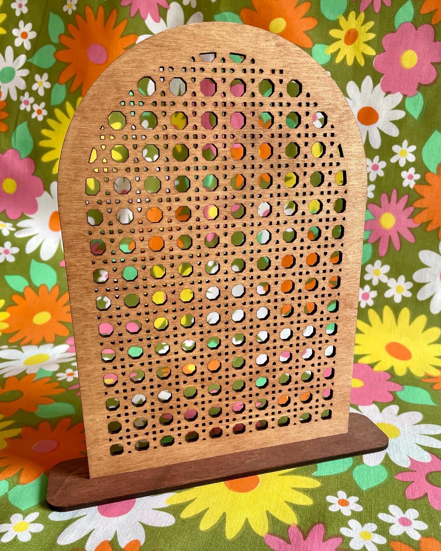 A stylish Rattan Earring Stand made from laser cut birch plywood, featuring a rattan effect design, perfect for organizing jewelry.