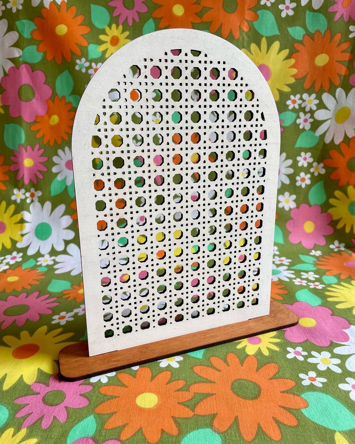 A stylish Rattan Earring Stand made from laser cut birch plywood, featuring a rattan effect design, perfect for organizing jewelry.