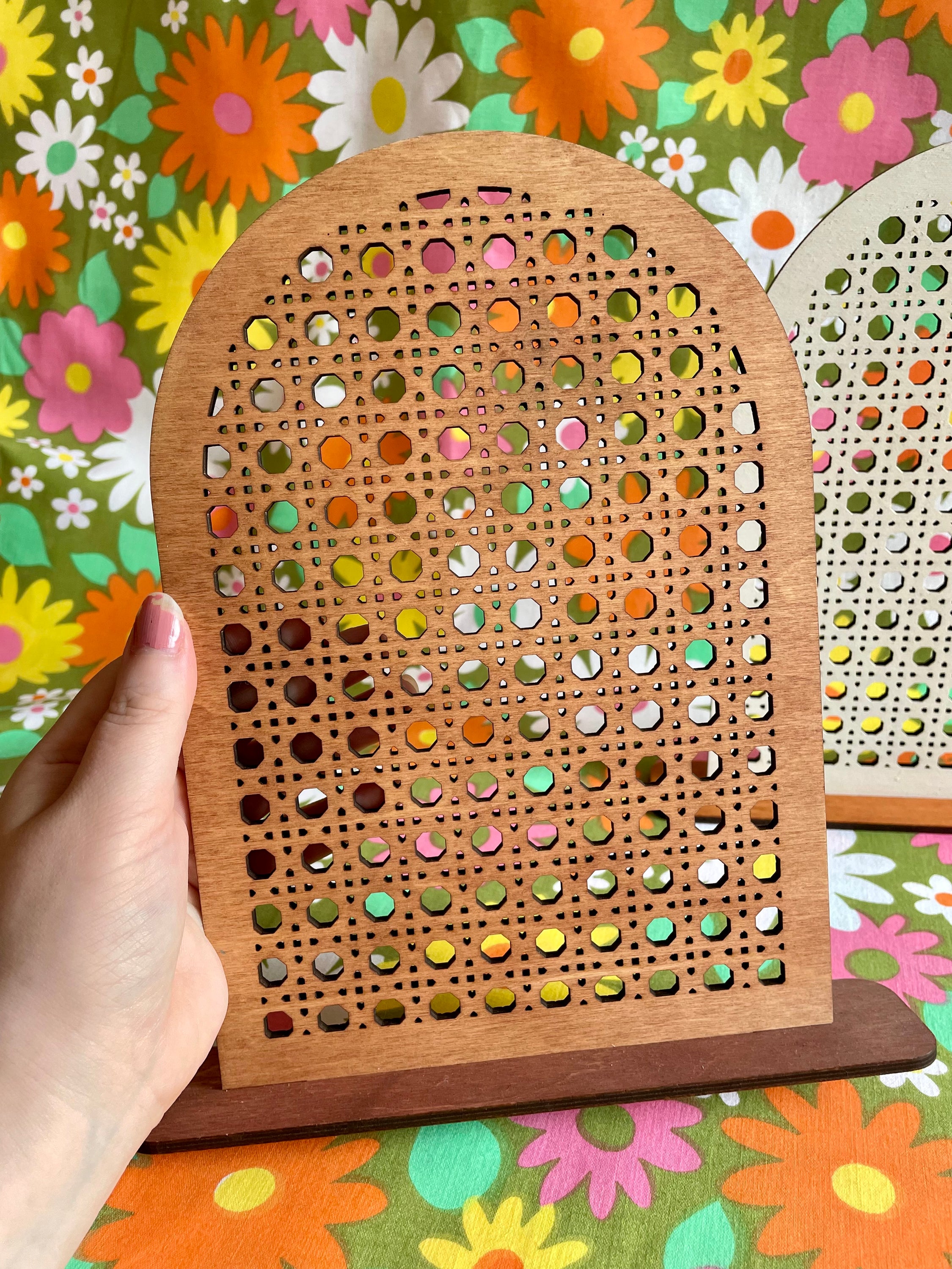 A stylish Rattan Earring Stand made from laser cut birch plywood, featuring a rattan effect design, perfect for organizing jewelry.