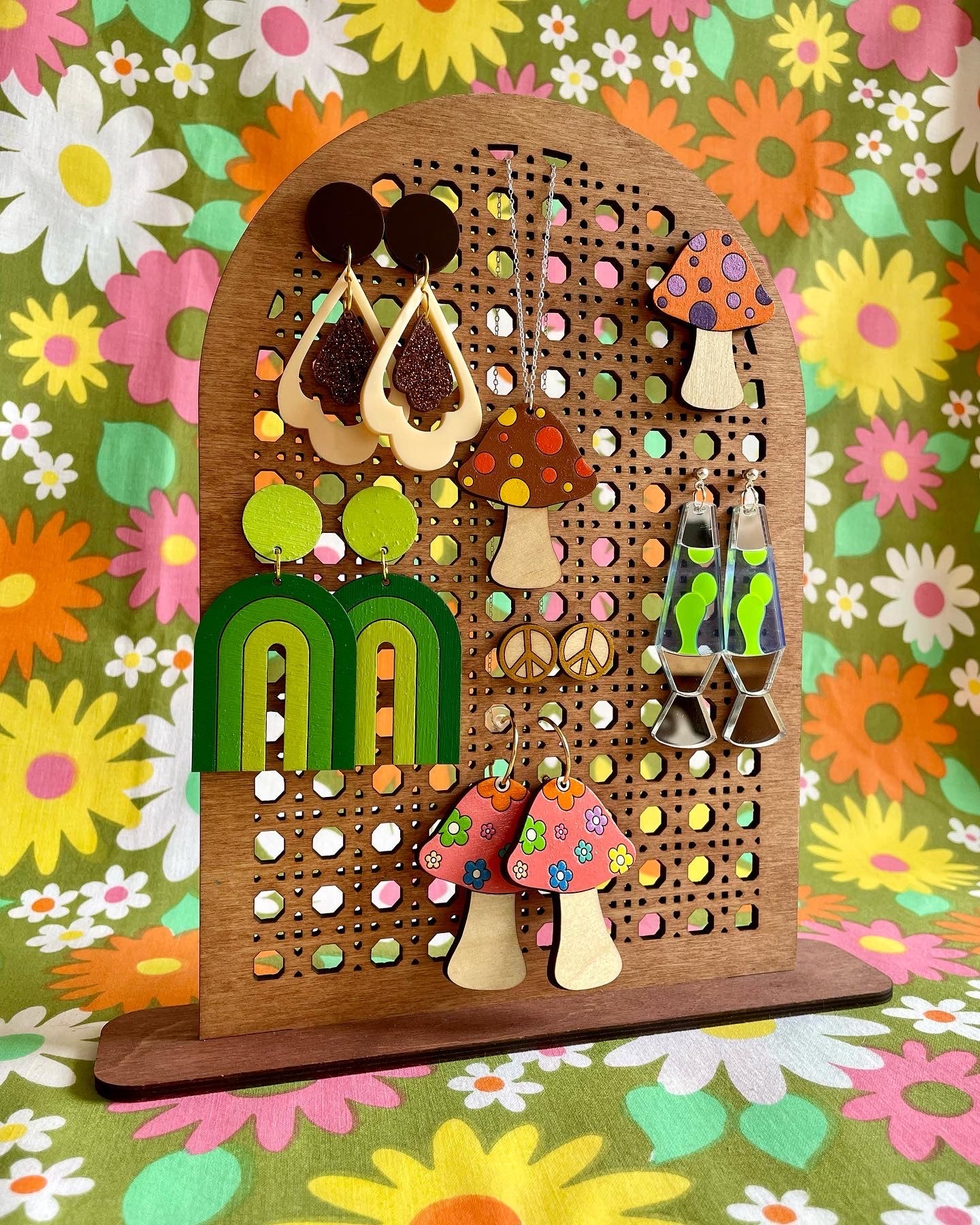 A stylish Rattan Earring Stand made from laser cut birch plywood, featuring a rattan effect design, perfect for organizing jewelry.