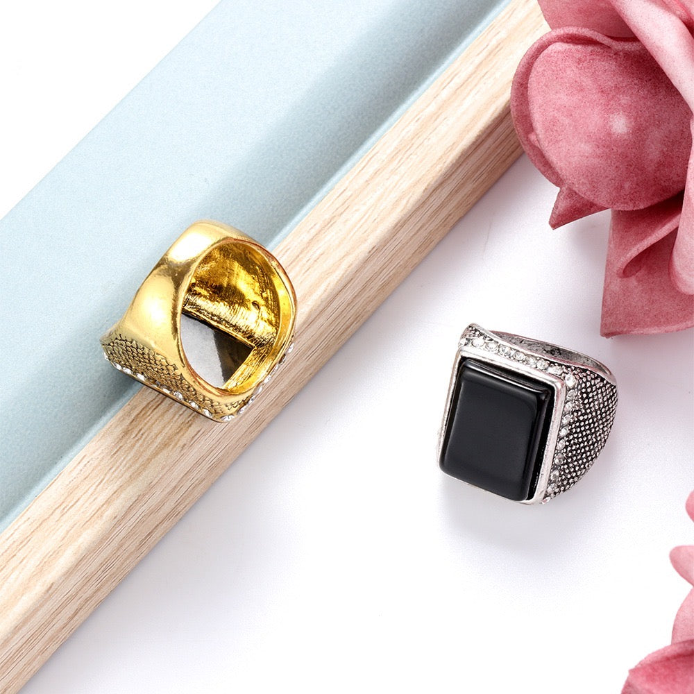 Elegant rectangle resin gemstone ring encircled by sparkling rhinestones, crafted from durable alloy.
