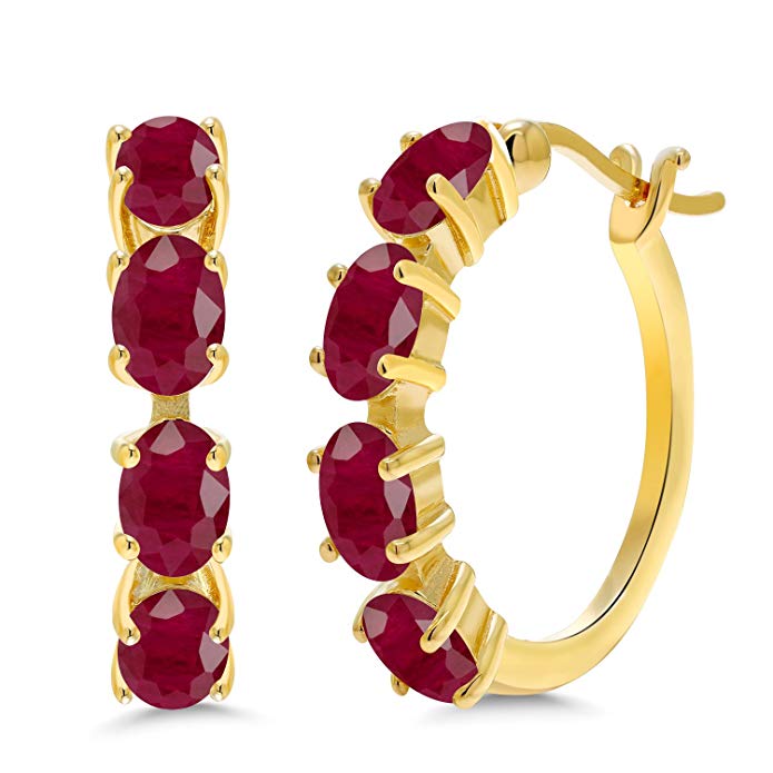 Elegant red crystal oval cut clip-on earrings with multi-stone lining in 14K gold plating, showcasing a luxurious design.