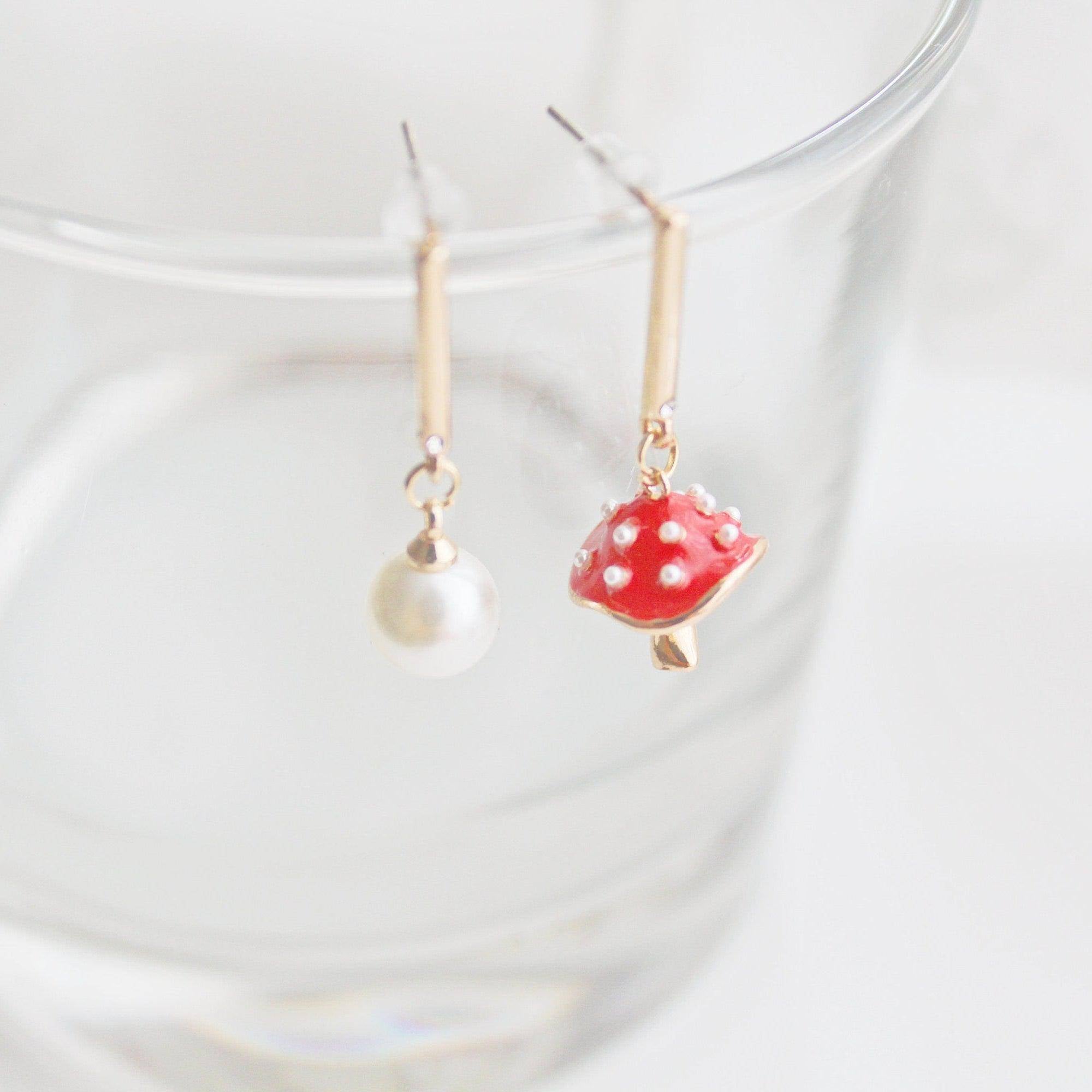 Red mushroom and pearl earrings.