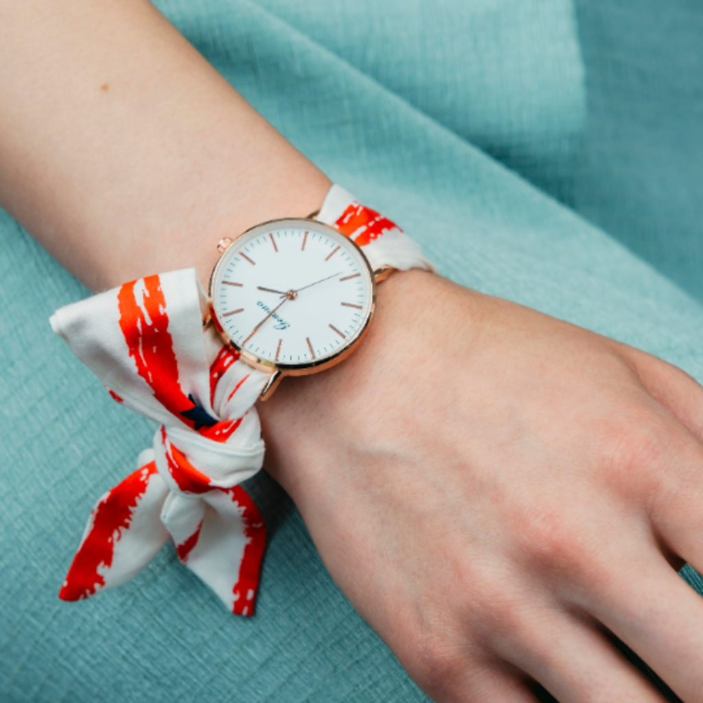 Red Star Print Changeable Fabric Strap Tie Knot Women Geneva watch featuring a vibrant red strap and elegant golden dial.