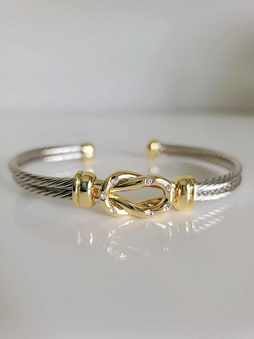 Reef Knot 18K Gold filled Silver cable bracelet featuring a double cable design and eye-catching knot pattern.