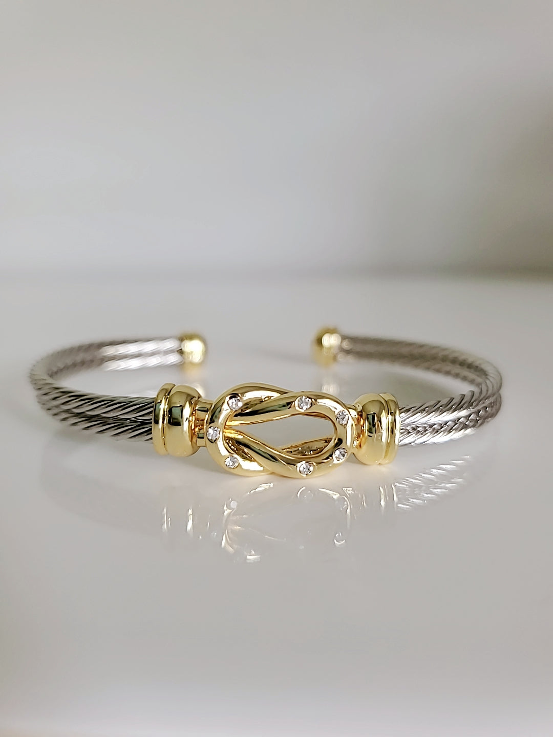 Reef Knot 18K Gold filled Silver cable bracelet featuring a double cable design and eye-catching knot pattern.