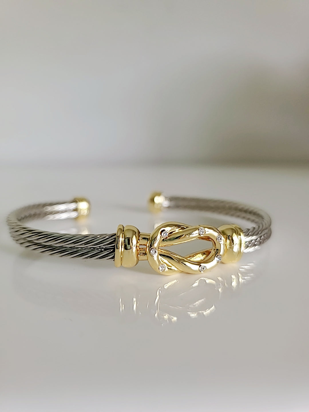 Reef Knot 18K Gold filled Silver cable bracelet featuring a double cable design and eye-catching knot pattern.