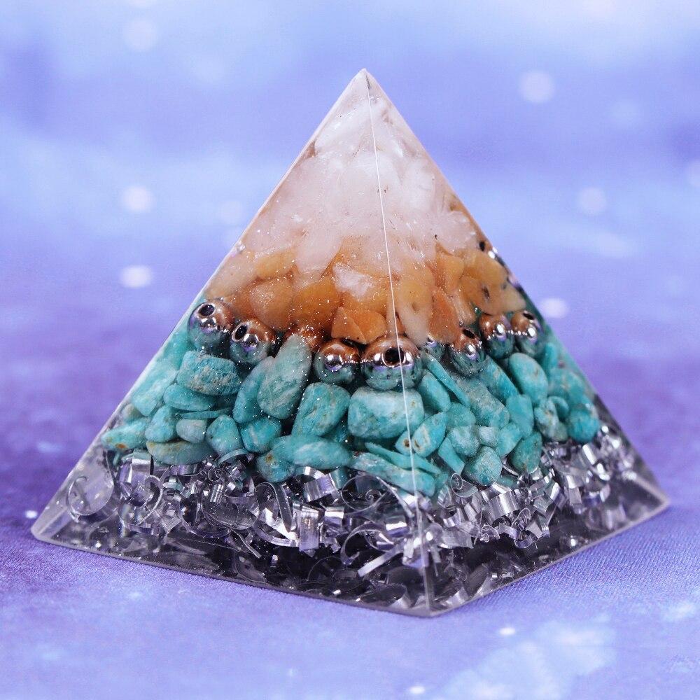 A beautifully handcrafted Reiki Orgonite Pyramid made from natural stones, aluminum scrap, and resin, measuring 5cm on each side.