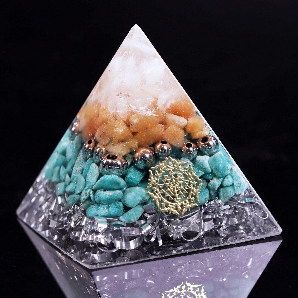 A beautifully handcrafted Reiki Orgonite Pyramid made from natural stones, aluminum scrap, and resin, measuring 5cm on each side.