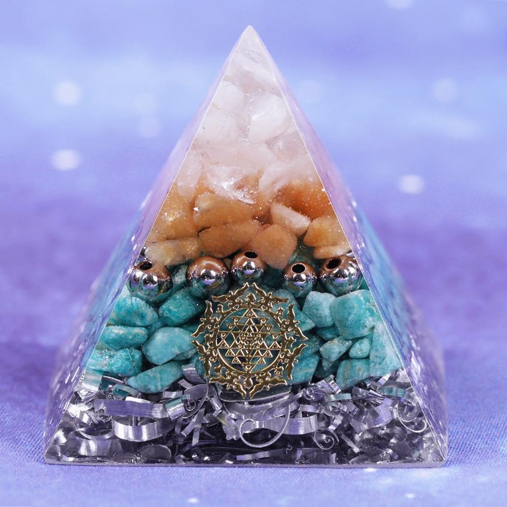 A beautifully handcrafted Reiki Orgonite Pyramid made from natural stones, aluminum scrap, and resin, measuring 5cm on each side.