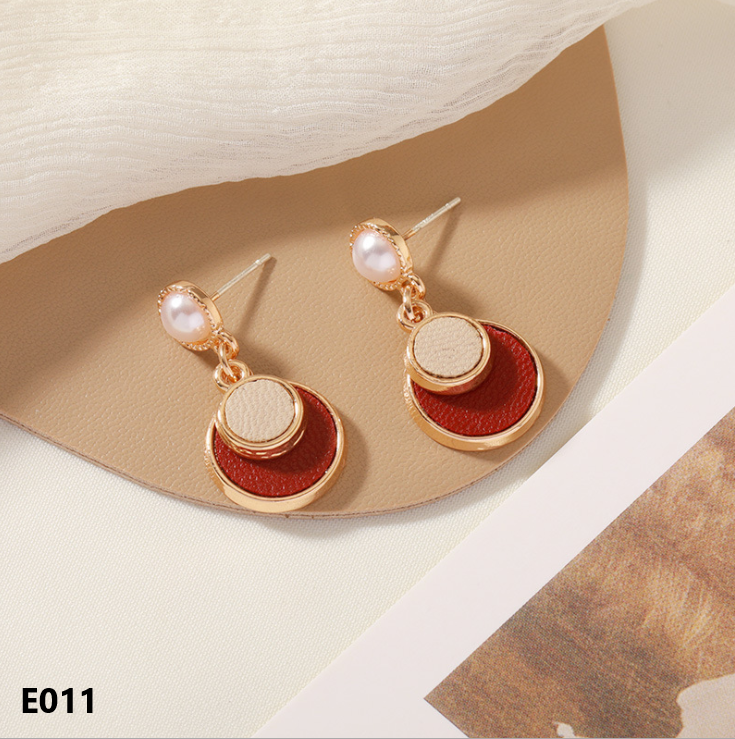 A pair of Retro Dripping Glaze Earrings featuring geometric designs and 925 silver needles, showcasing a unique vintage style.