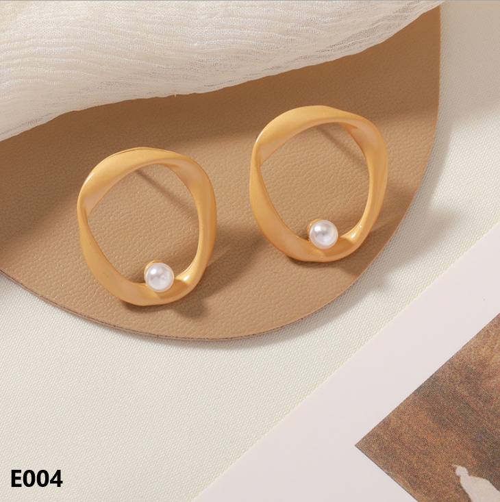 A pair of Retro Dripping Glaze Earrings featuring geometric designs and 925 silver needles, showcasing a unique vintage style.