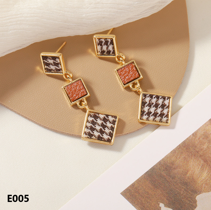 A pair of Retro Dripping Glaze Earrings featuring geometric designs and 925 silver needles, showcasing a unique vintage style.