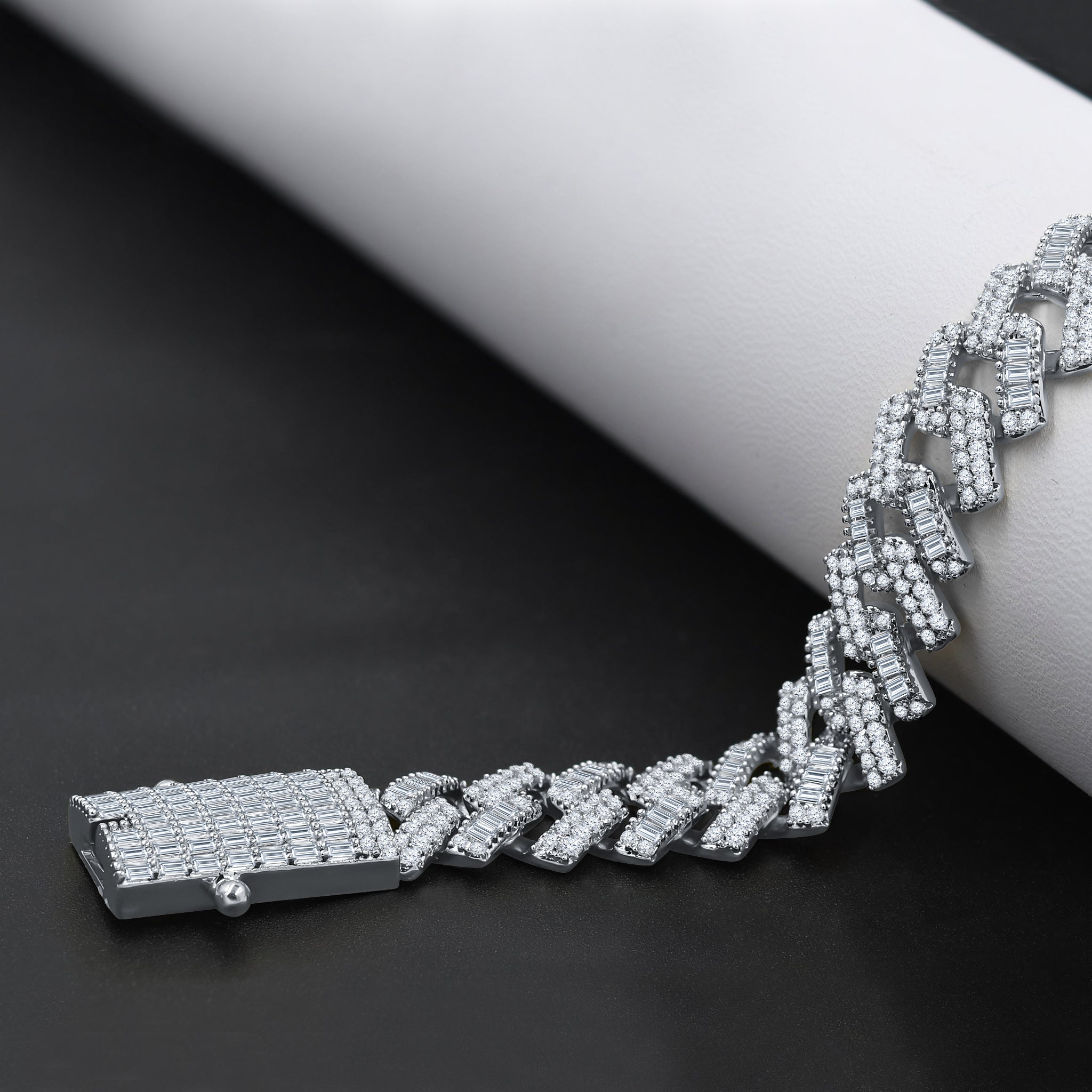 Rime Sterling Silver 12MM CZ Chain featuring hand-set cubic zirconia stones, showcasing its elegant design and durable construction.