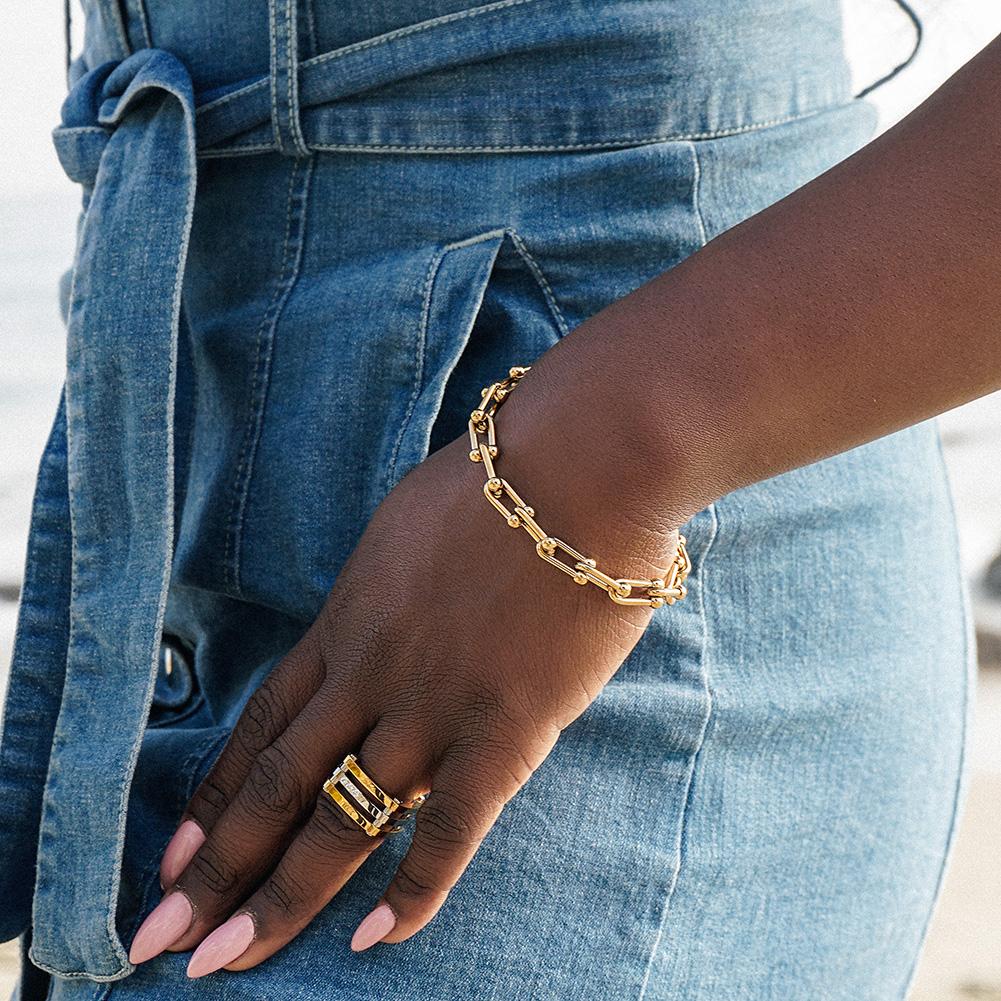 Roman Numeral Chain Set featuring a gold-plated bangle, bracelet, and adjustable ring with CZ accents.