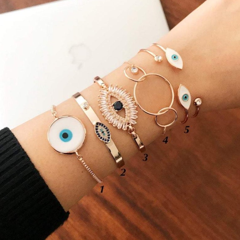 Rose Gold Evil Eye Bracelet Set featuring a movable oval charm and adjustable bangle design, crafted from tarnish-resistant stainless steel.