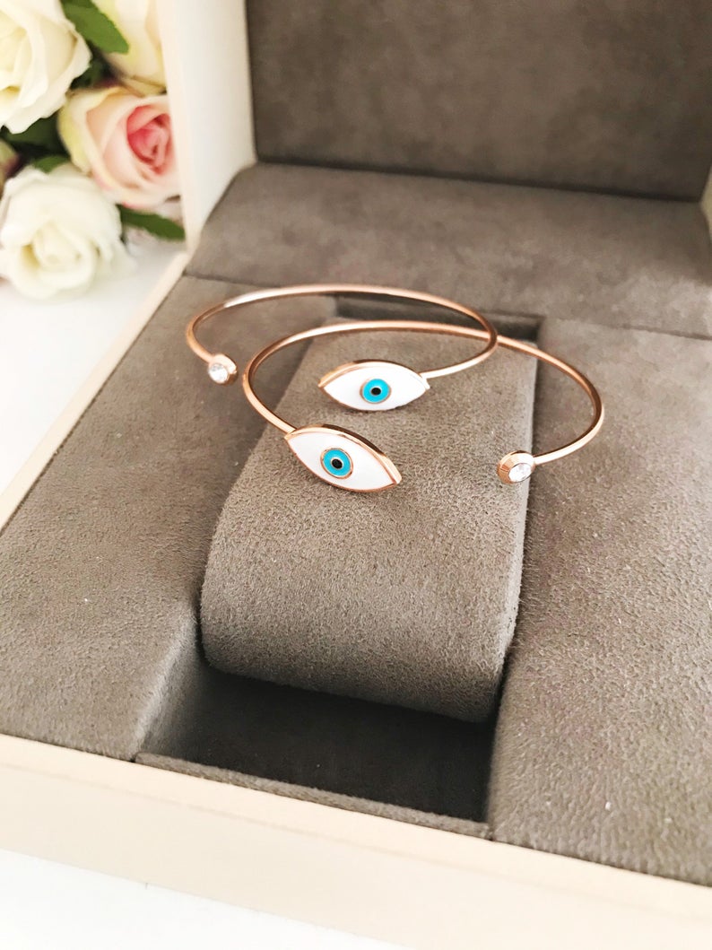 Rose Gold Evil Eye Bracelet Set featuring a movable oval charm and adjustable bangle design, crafted from tarnish-resistant stainless steel.