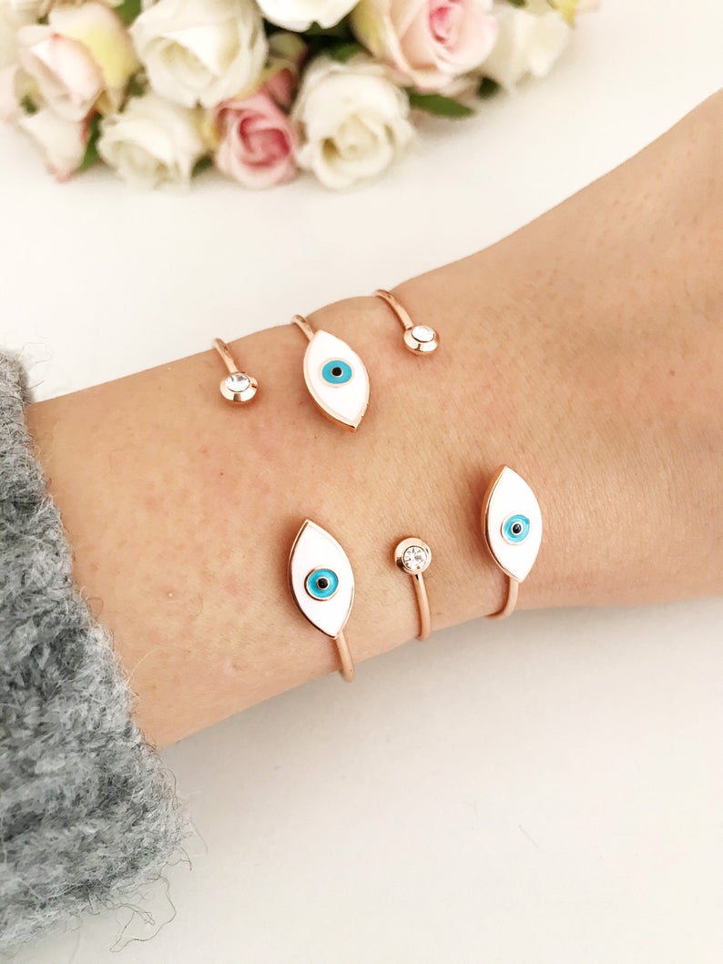 Rose Gold Evil Eye Bracelet Set featuring a movable oval charm and adjustable bangle design, crafted from tarnish-resistant stainless steel.