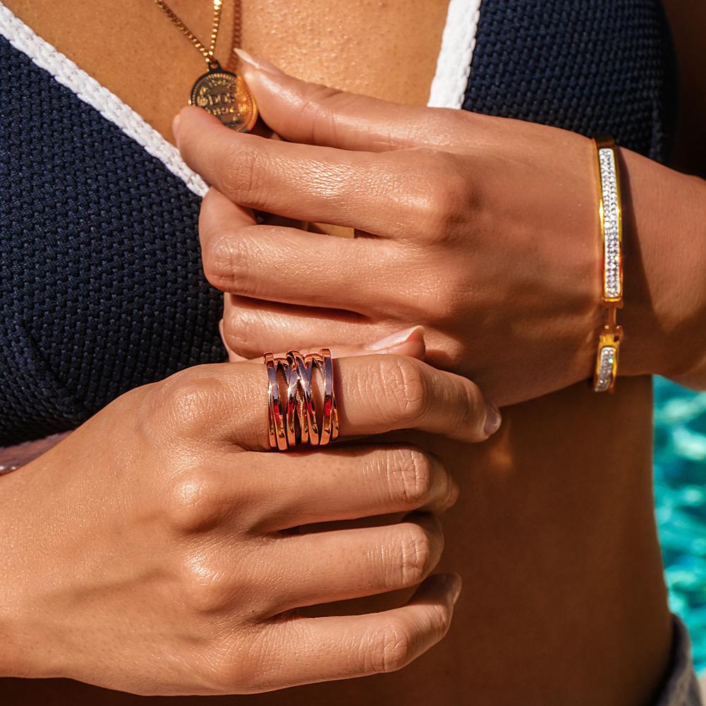 Rose Gold Intertwined Statement Ring made of surgical stainless steel with a luxurious gold finish, showcasing an elegant intertwined design.