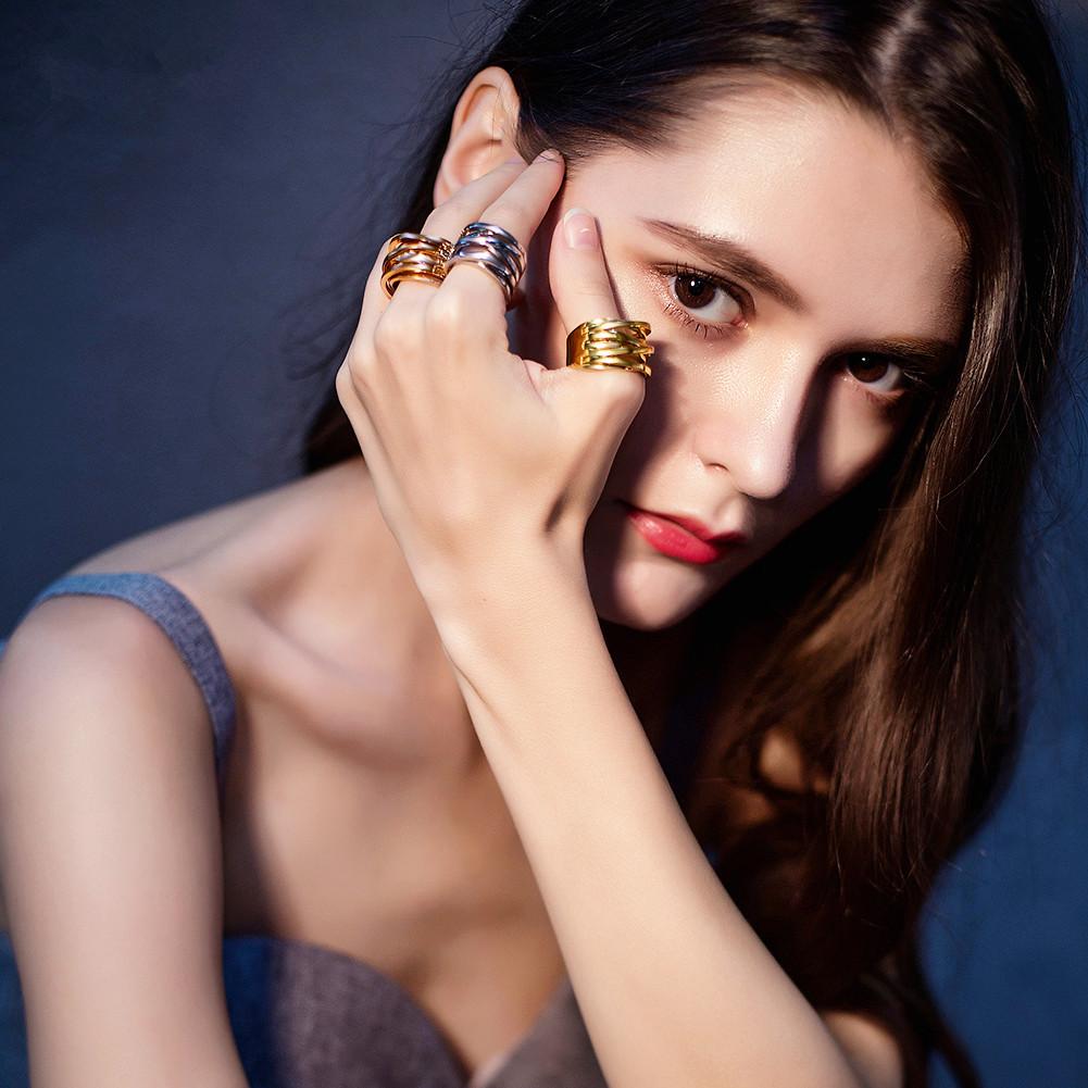 Rose Gold Intertwined Statement Ring made of surgical stainless steel with a luxurious gold finish, showcasing an elegant intertwined design.