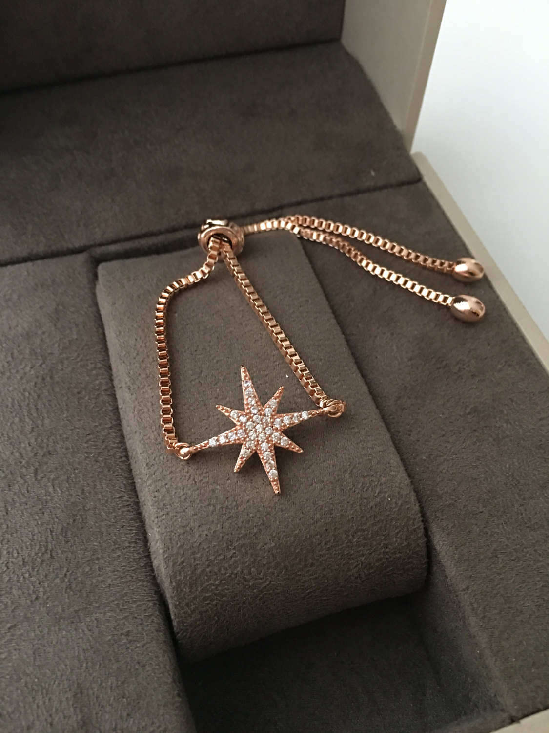 Handmade Rose Gold Star Bracelet featuring a zircon charm, adjustable design, and tarnish-resistant stainless steel material.