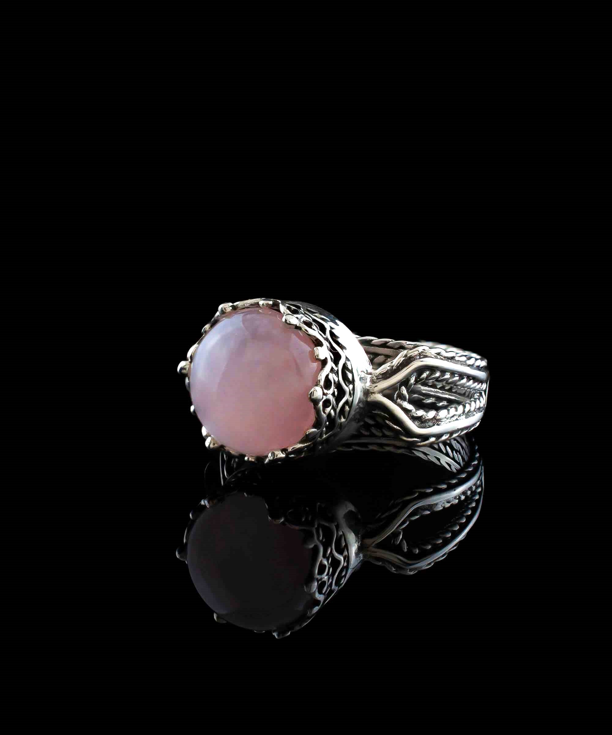 Elegant Rose Quartz Gemstone Filigree Art Sterling Silver Cocktail Ring featuring a round cut pink stone and intricate metalwork design.