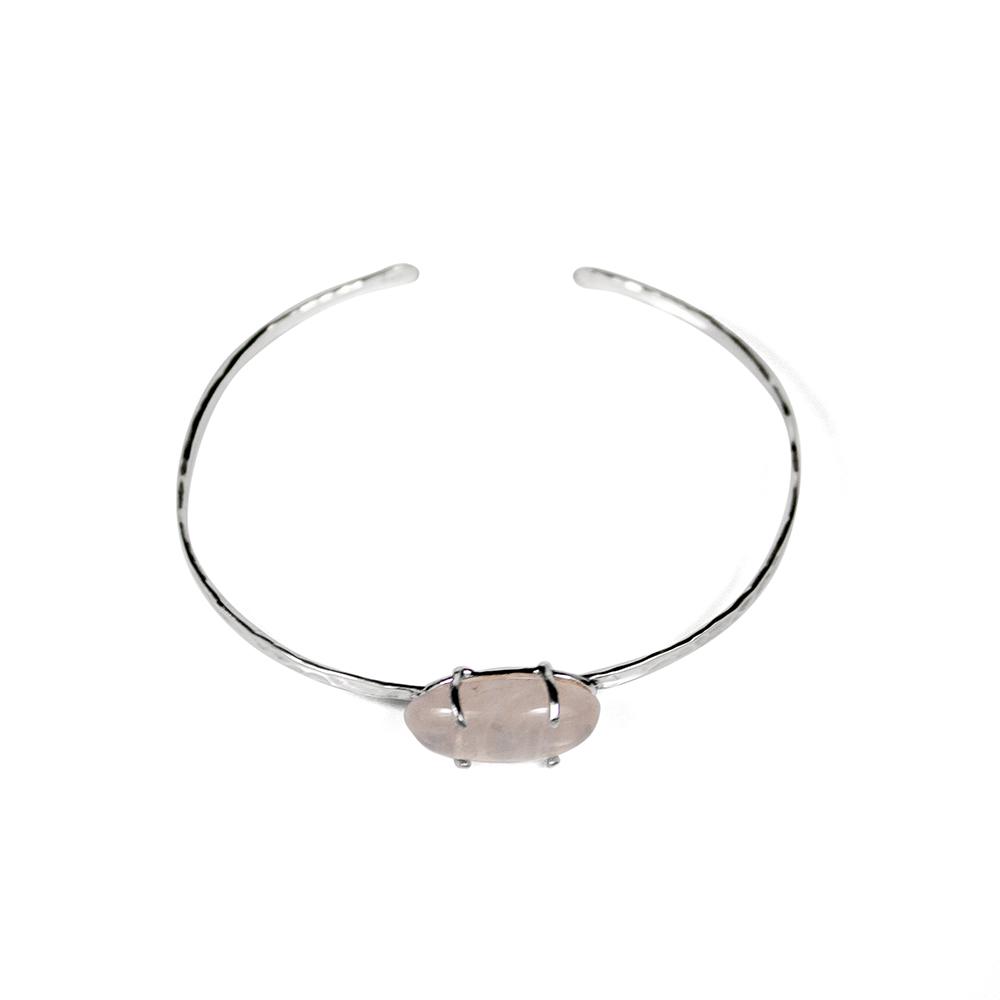 A handcrafted rose quartz hammered cuff bracelet made of sterling silver, featuring a beautiful oval cabochon rose quartz stone.