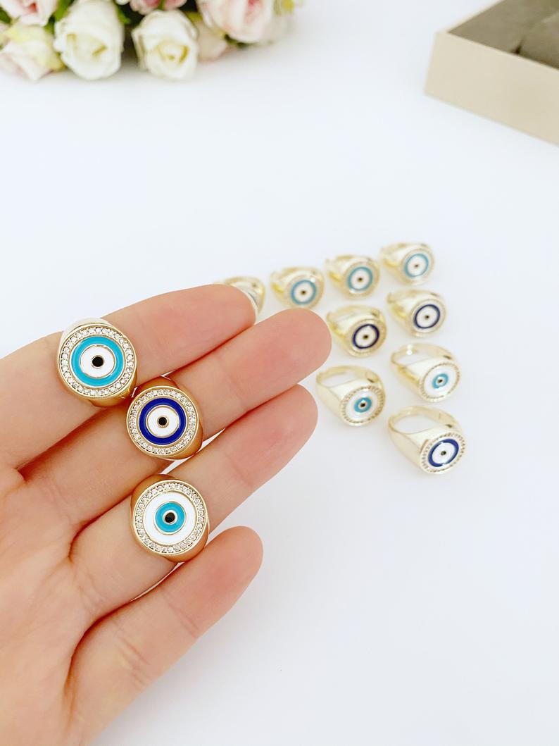 Adjustable gold Round Evil Eye Ring featuring a blue evil eye design, perfect for boho jewelry enthusiasts.