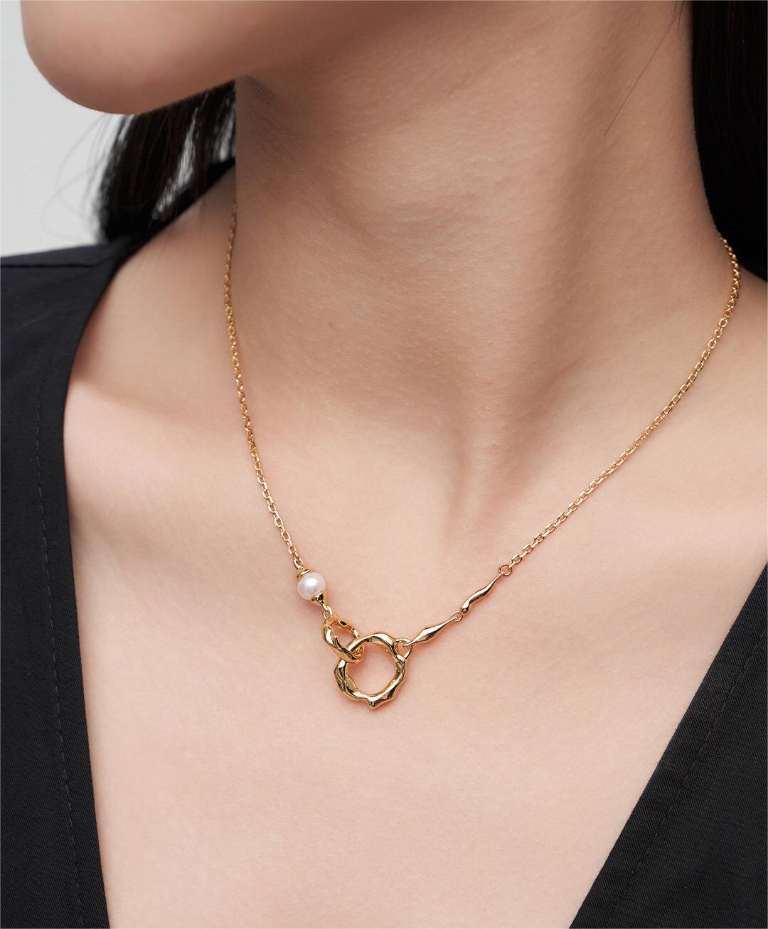 Elegant Round Black Onyx and Pearl Necklace with gold vermeil chain, showcasing natural pearls and onyx stones.