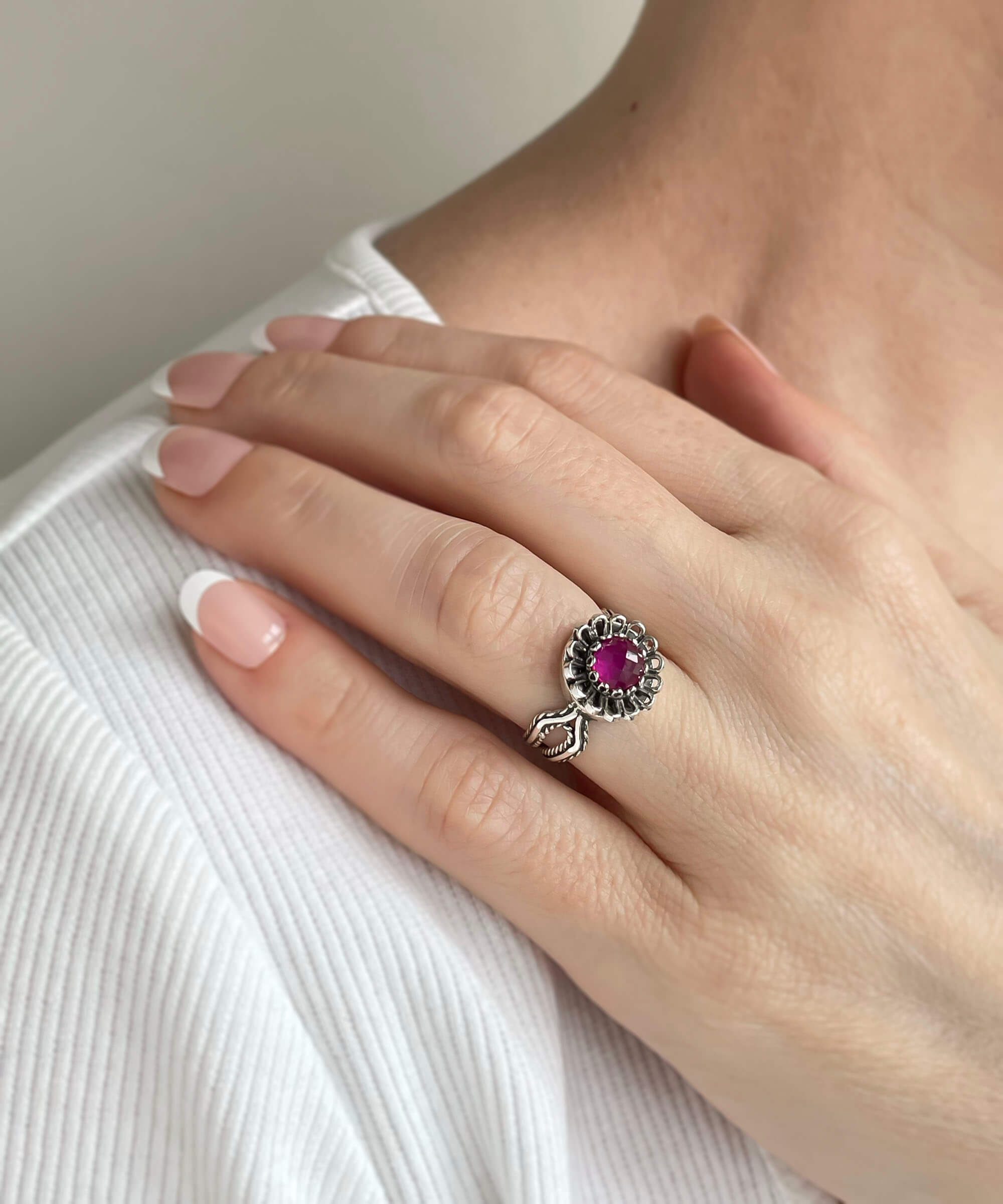 Elegant Ruby Corundum Gemstone Sterling Silver Cocktail Ring with intricate flower design and luxurious finish.