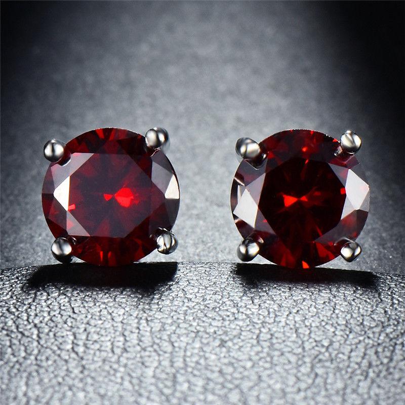 Elegant Ruby Created Crystal 6mm Stud Earrings in 14K White Gold Plated, showcasing vibrant red crystals and a luxurious design.