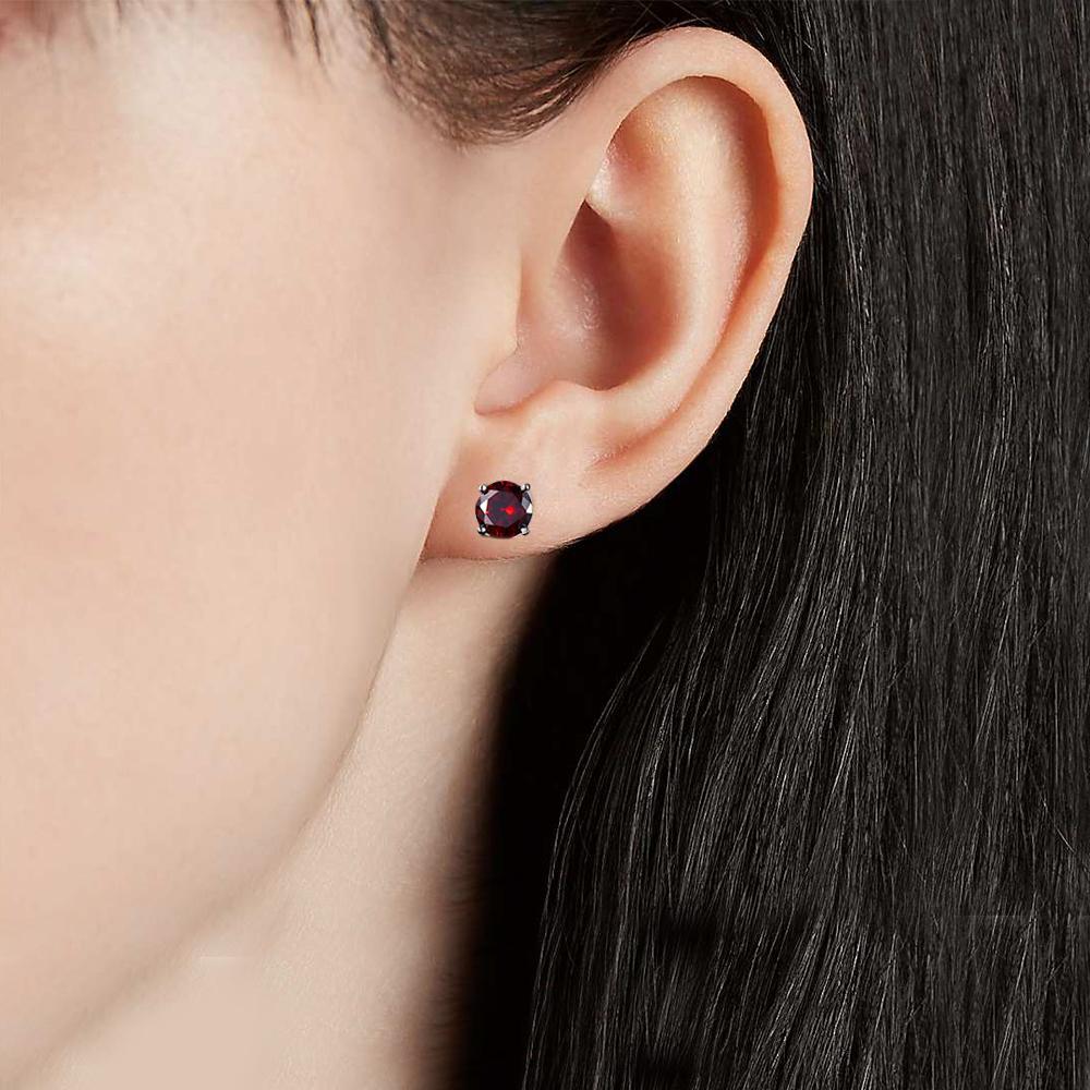 Elegant Ruby Created Crystal 6mm Stud Earrings in 14K White Gold Plated, showcasing vibrant red crystals and a luxurious design.