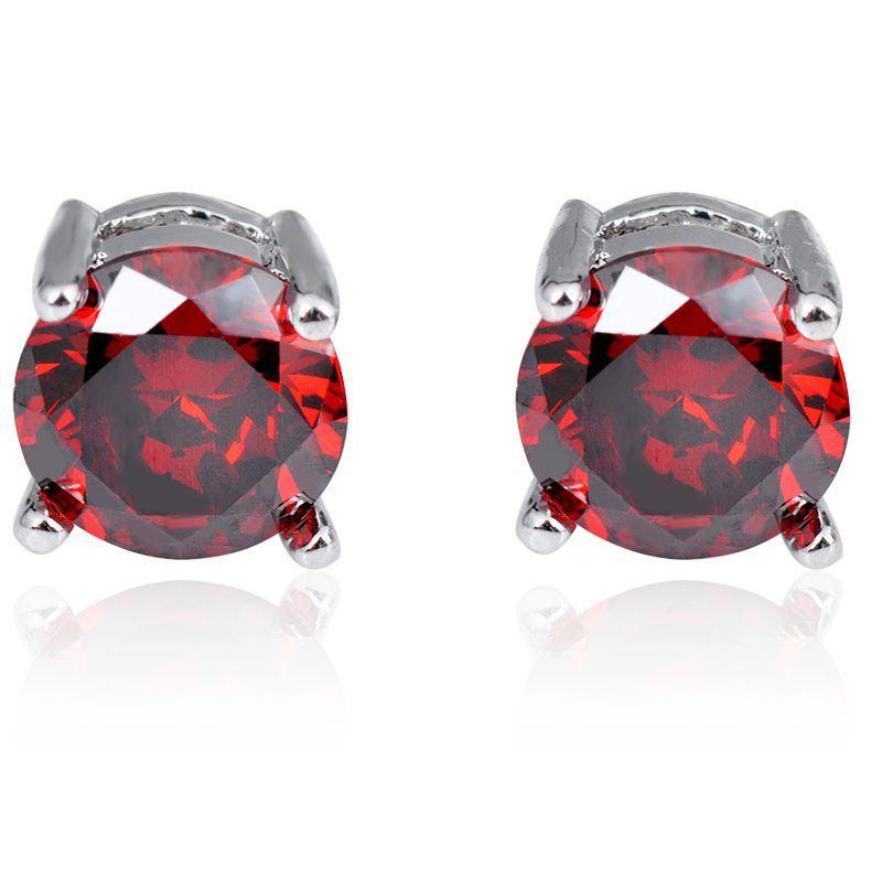 Elegant Ruby Created Crystal 6mm Stud Earrings in 14K White Gold Plated, showcasing vibrant red crystals and a luxurious design.