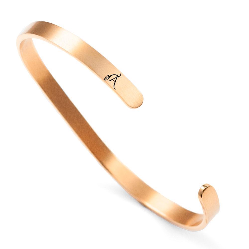 Elegant 'Rêve' cuff in stainless steel with 18K rose gold plating, showcasing a dainty design perfect for everyday wear.