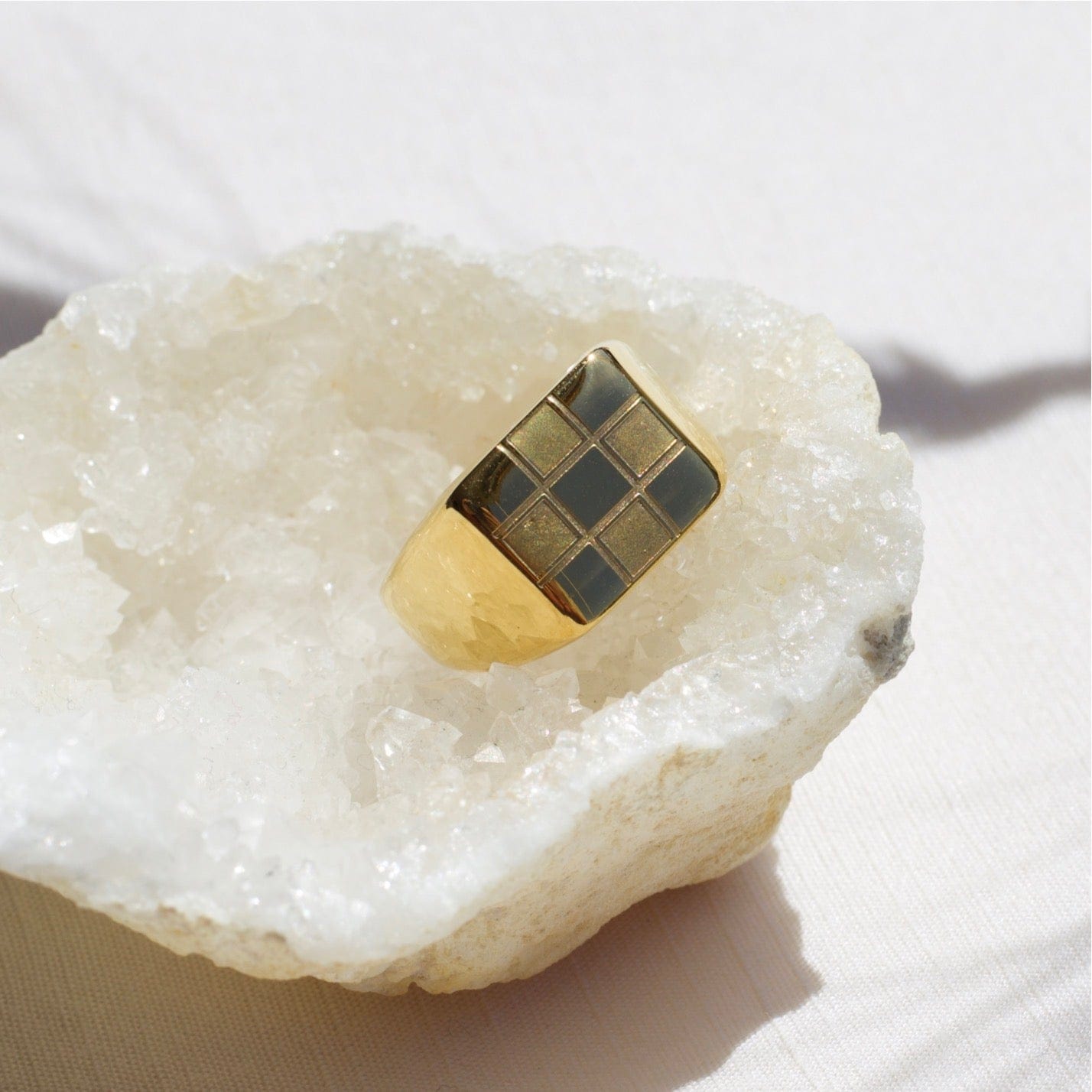 Sacra Geometric Gold Check-board Block Ring showcasing its elegant design and 18Kt yellow gold coating.