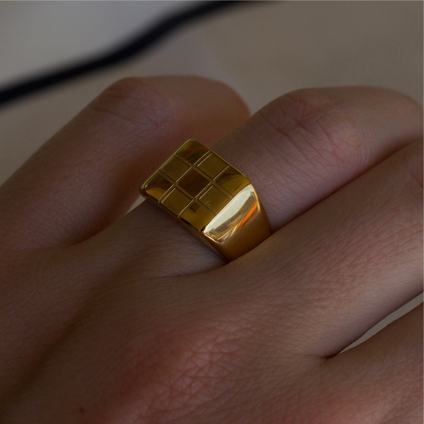 Sacra Geometric Gold Check-board Block Ring showcasing its elegant design and 18Kt yellow gold coating.