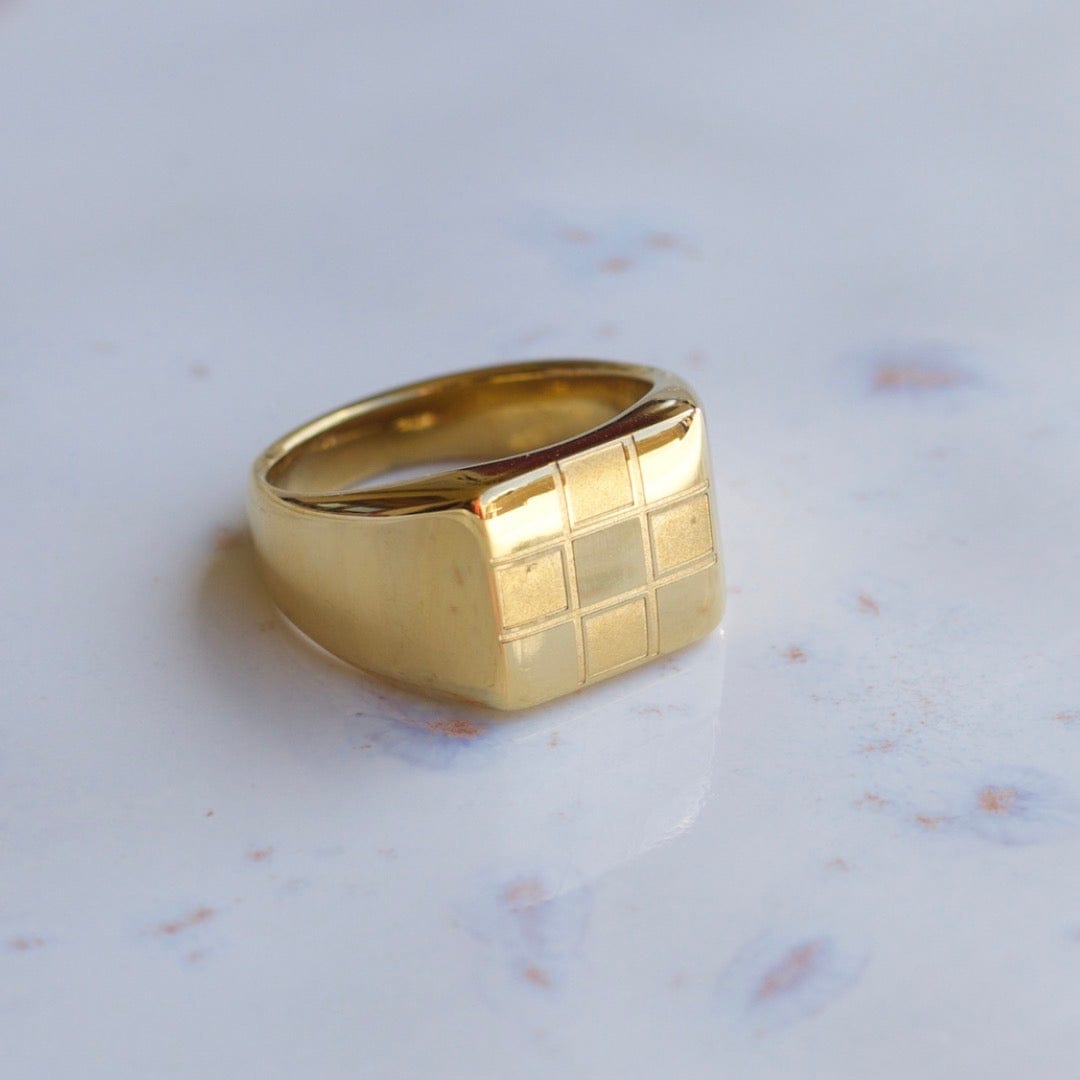 Sacra Geometric Gold Check-board Block Ring showcasing its elegant design and 18Kt yellow gold coating.