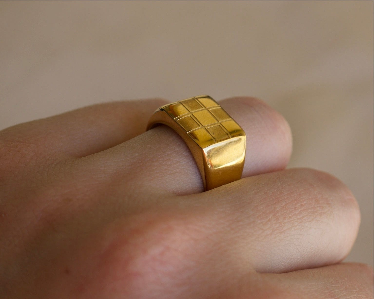 Sacra Geometric Gold Check-board Block Ring showcasing its elegant design and 18Kt yellow gold coating.