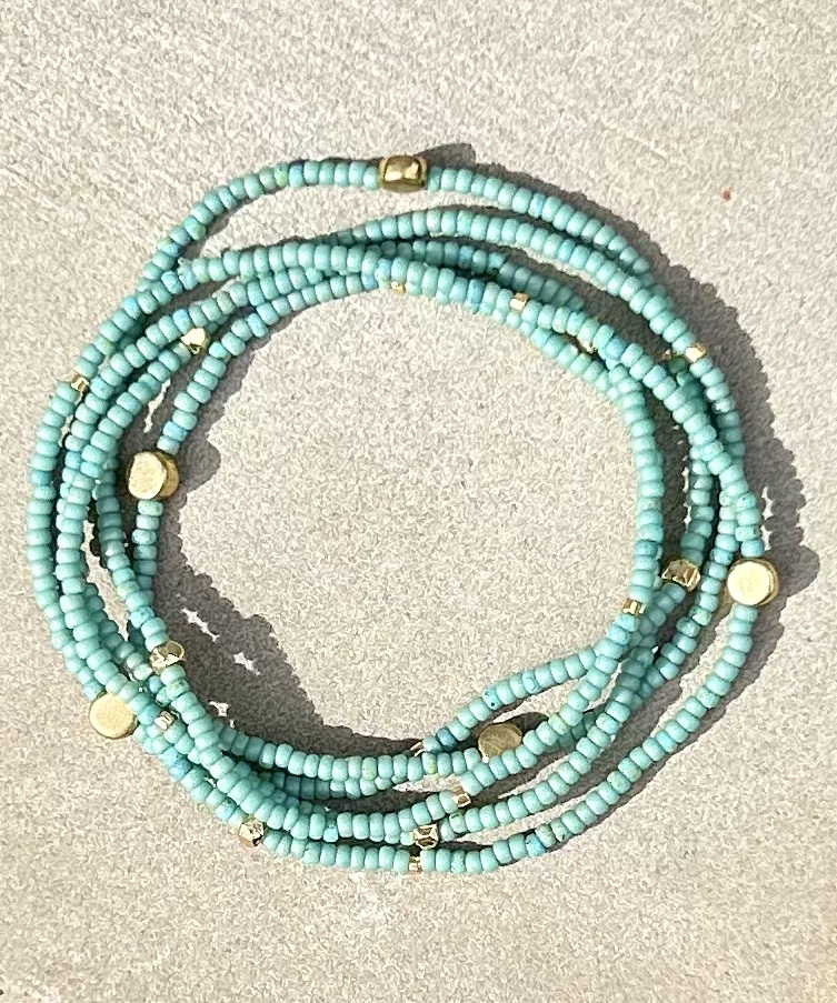 Sage green boho bracelet with gold sprinkles, showcasing a layered 5-wrap design made from Czech glass seed beads.