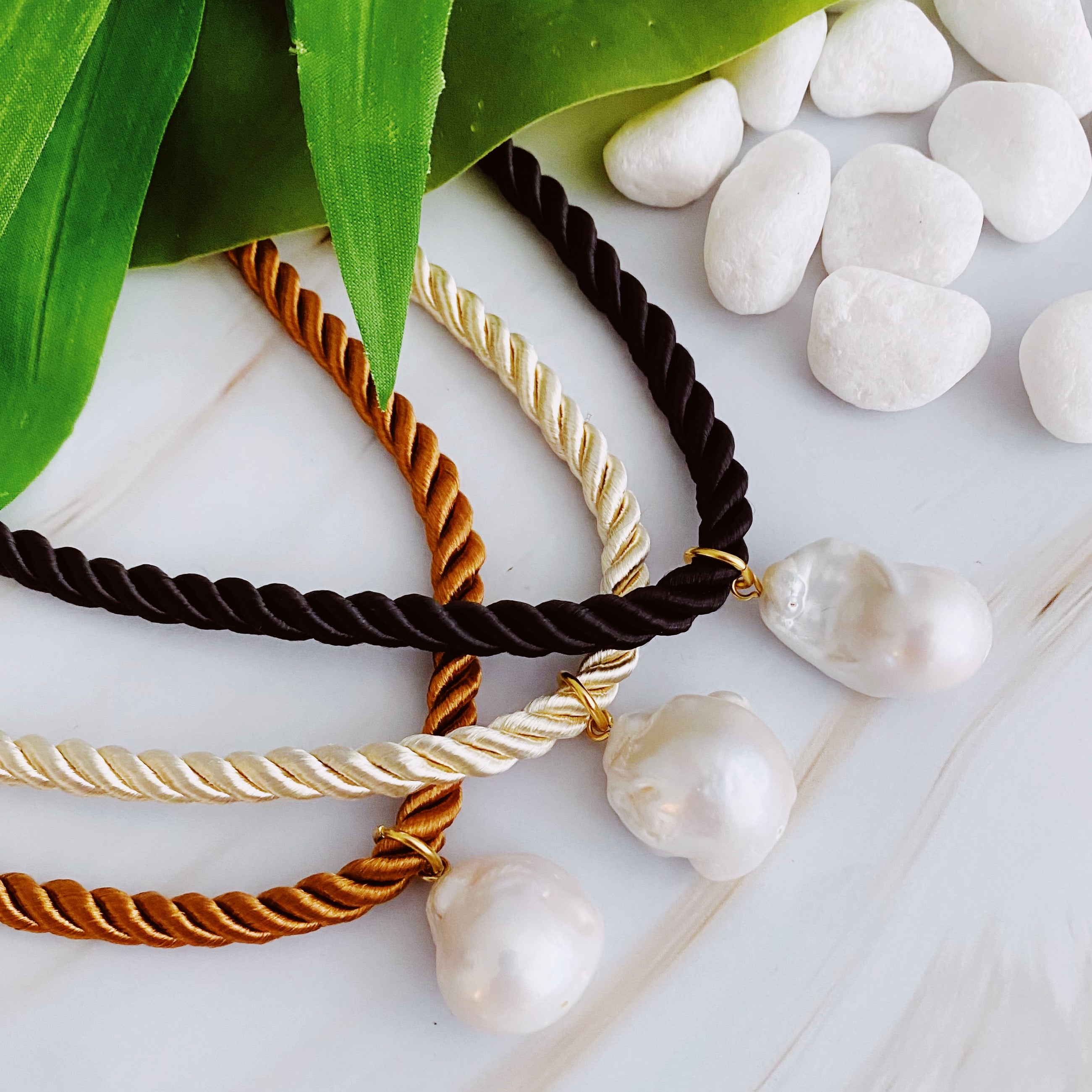 A stylish Satin Rope Baroque Pearl Necklace featuring a unique baroque pearl and elegant satin rope design, perfect for any occasion.