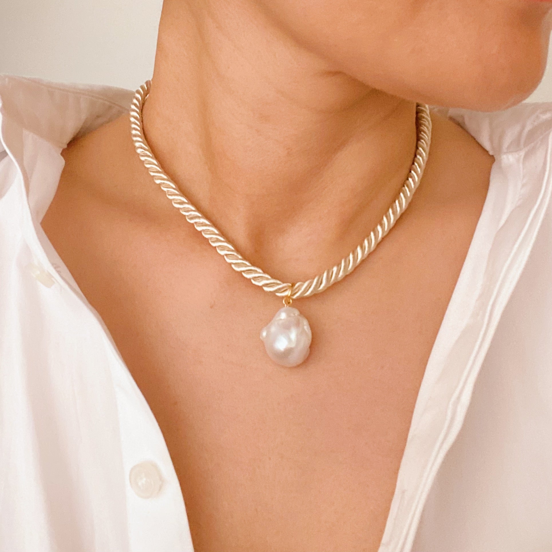 A stylish Satin Rope Baroque Pearl Necklace featuring a unique baroque pearl and elegant satin rope design, perfect for any occasion.