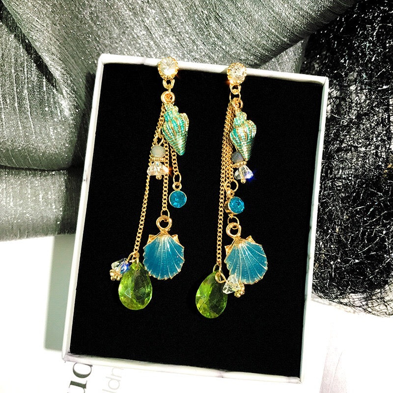 Elegant Sea Shell Slinky Drop Earrings made of alloy, rhinestone, and 925 silver, showcasing a unique design.