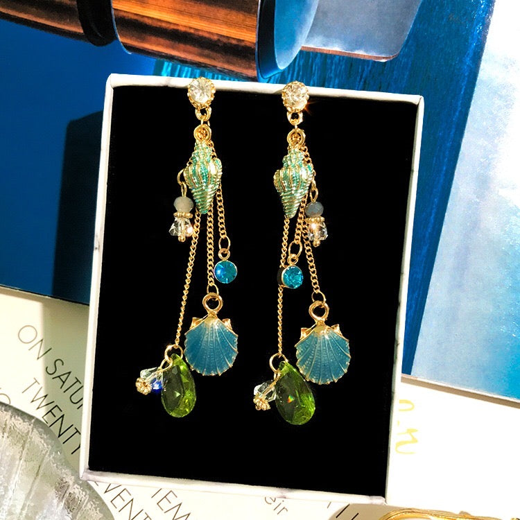 Elegant Sea Shell Slinky Drop Earrings made of alloy, rhinestone, and 925 silver, showcasing a unique design.